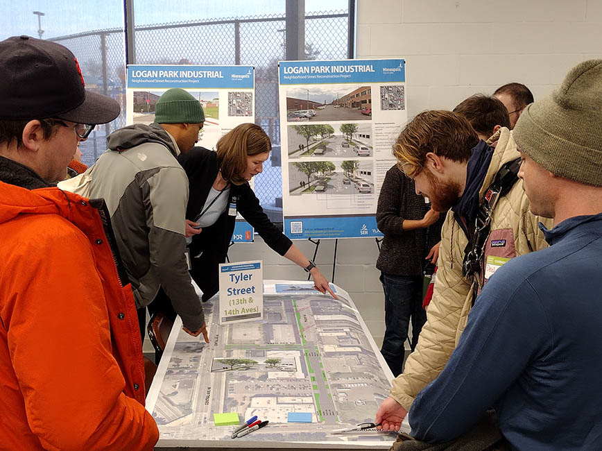 A group of people looking at concept layouts.