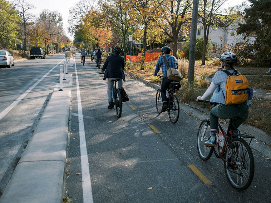 A group of people riding bikes
