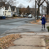 A person crossing the street