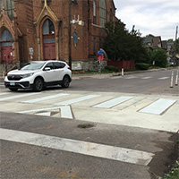 A raised crossing at Monroe St NE and 13th Ave NE