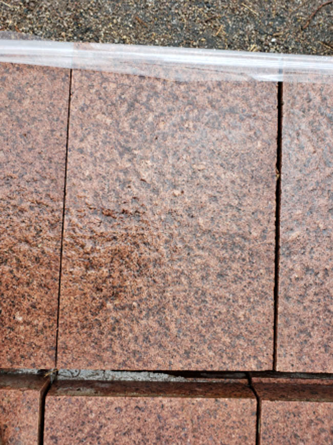 A red granite paving stone from Nicollet Mall.