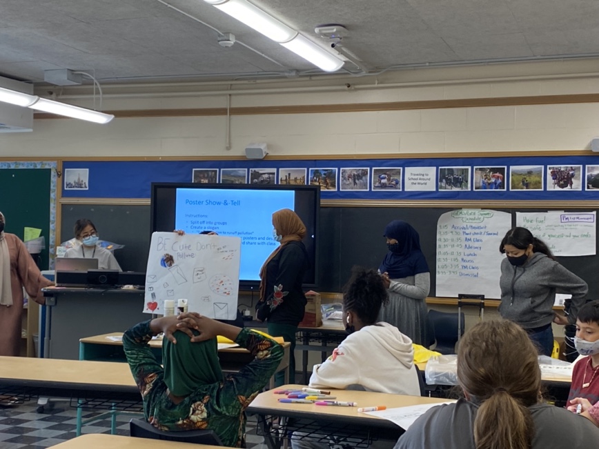 Teachers and students interacting in a school classroom