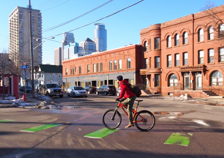 Bike conflict striping - Signifies areas where people biking & driving may interact; People driving must yield to people biking through intersection.