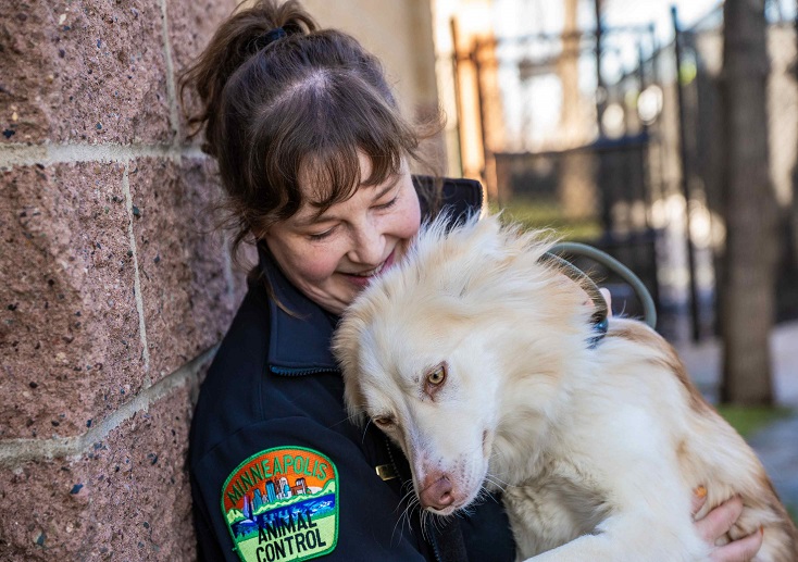 Animal care and control officer with dog