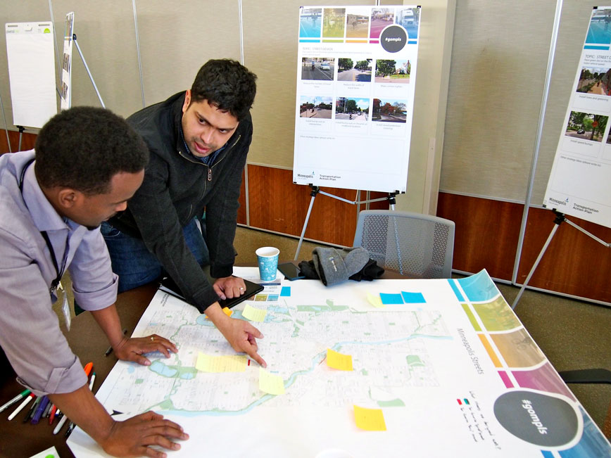 City staff talks with individuals about questions and ideas to design action