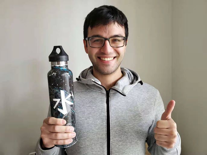 man holding reusable water bottle