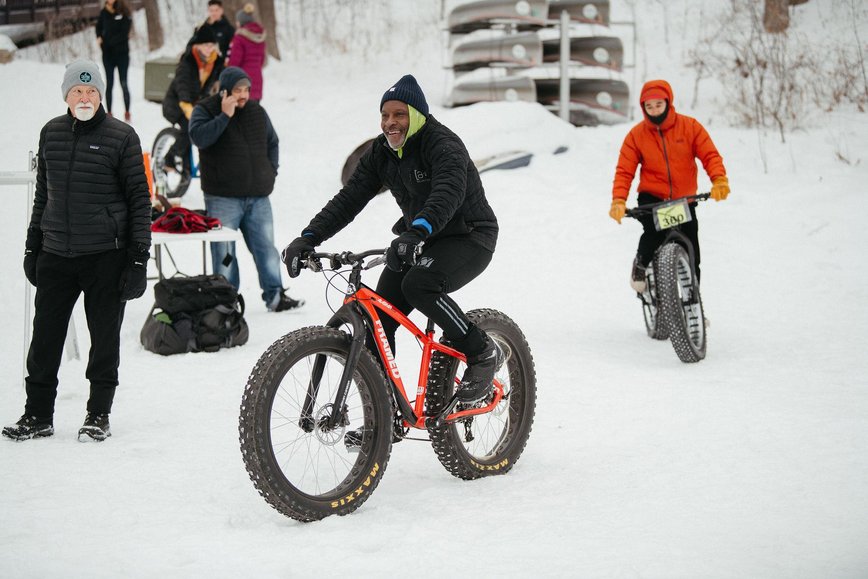People biking in snow by Meet Minneapolis