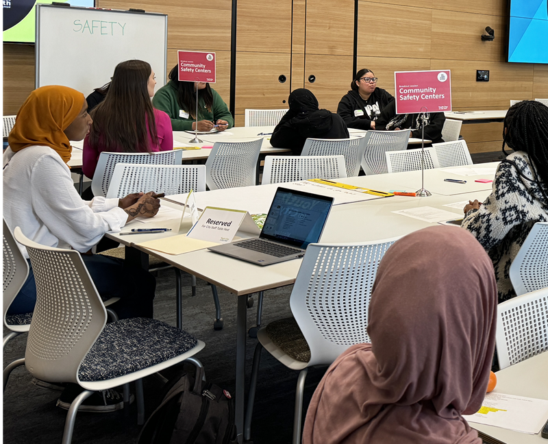 Youth discussing community safety centers