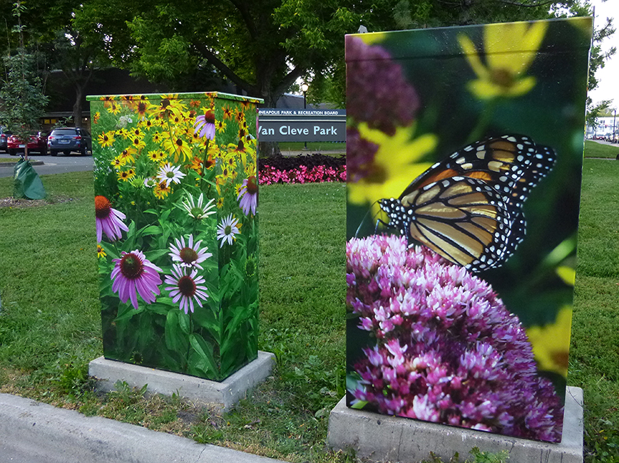 Two utility boxes wraps with colorful plants
