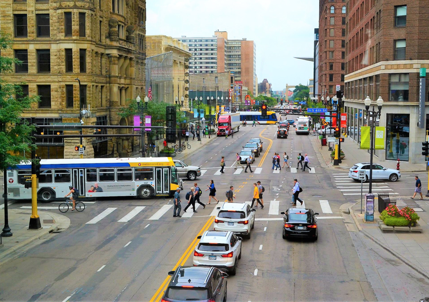 Downtown cars, bus, pedestrians