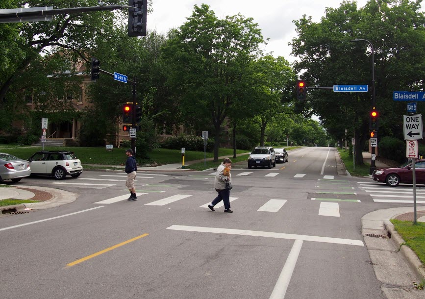 Marked crosswalk - Creates a more visible crossing for people walking, rolling, and driving; Shown to improve yielding behavior of people driving.