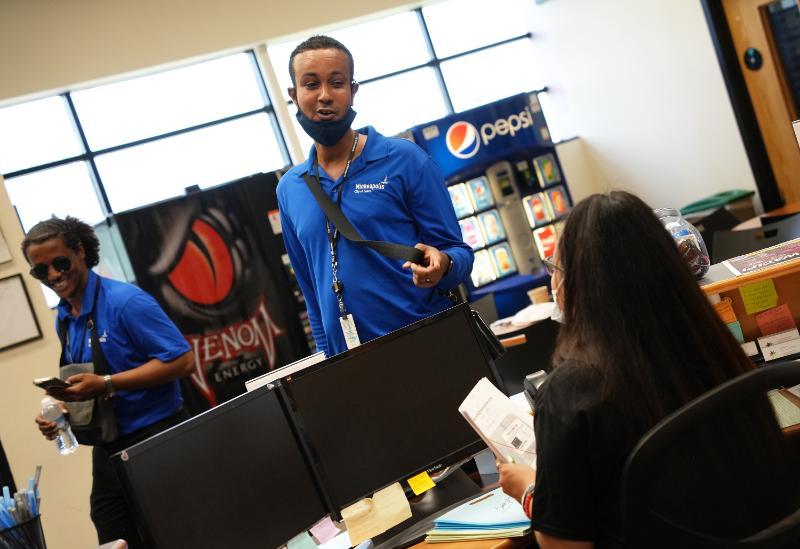 A Community Safety Ambassador visits with a local business.