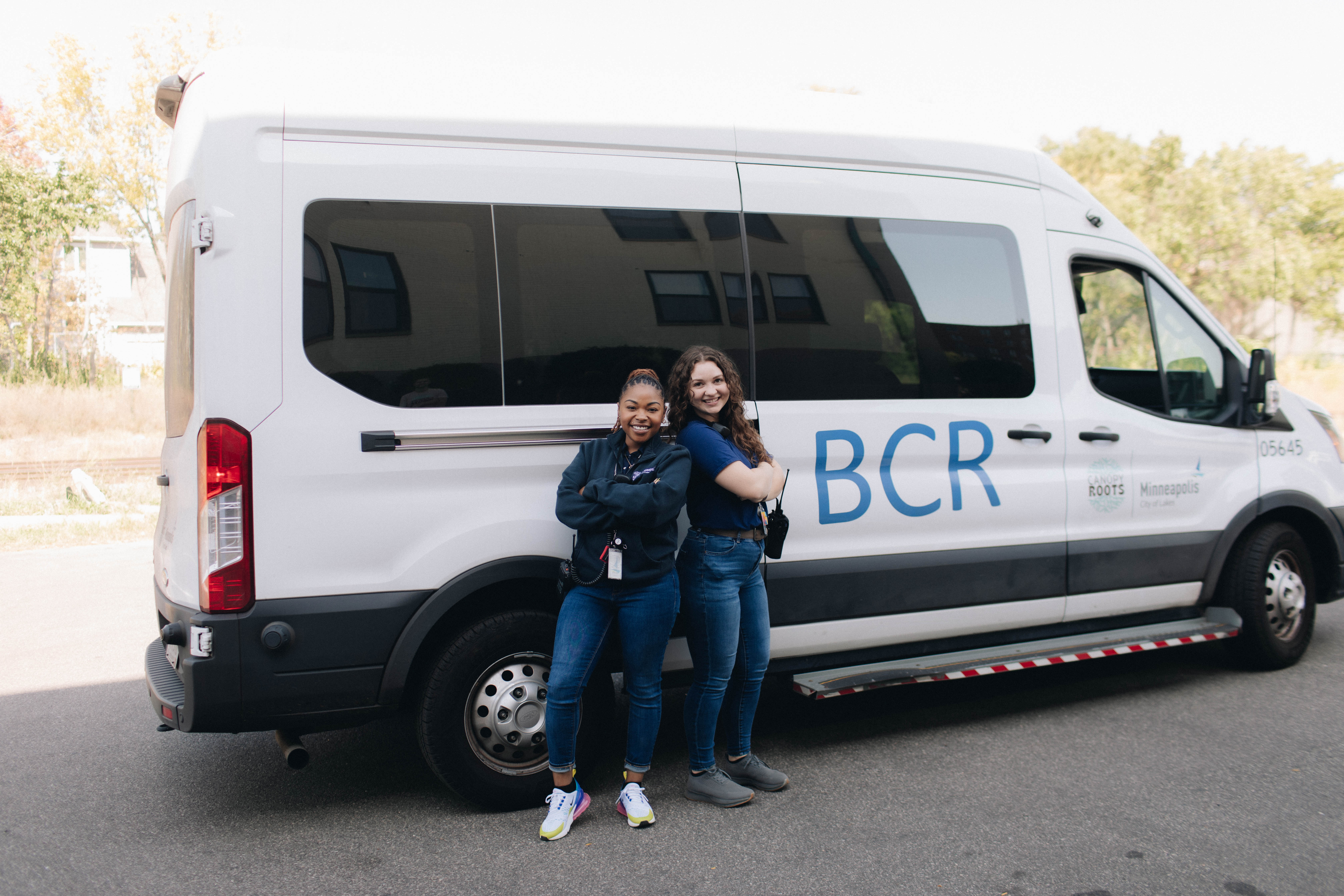 Two BCR employees standing in front of the BCR van