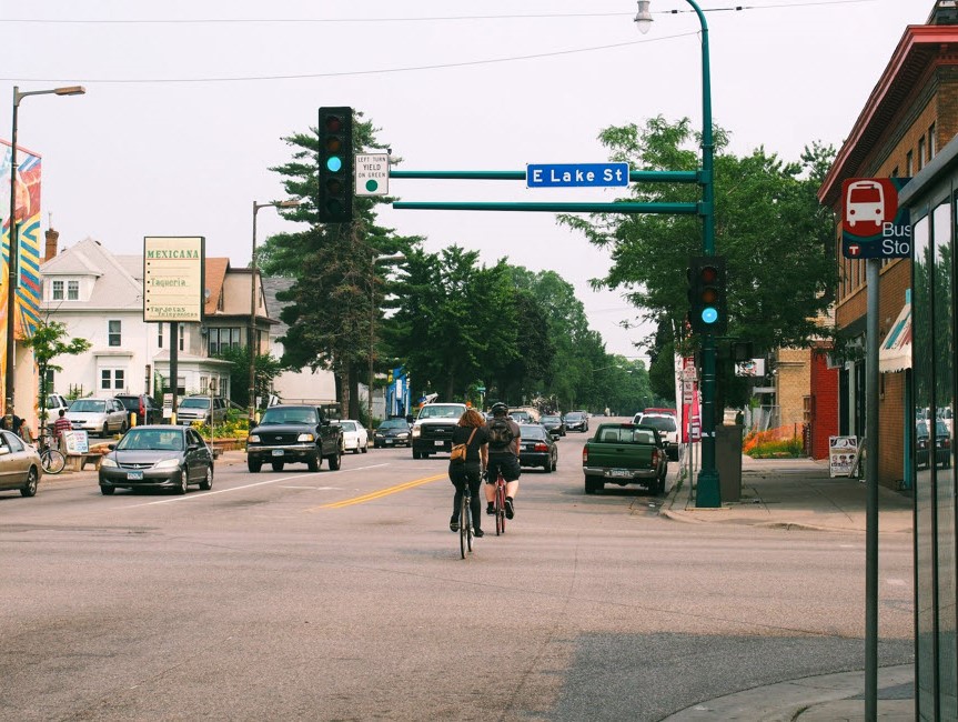 Person biking down East Lake Street