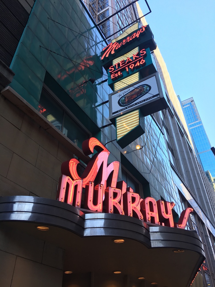 Neon sign outside of Murrays Steaks, photo credit: Jason Wittenberg