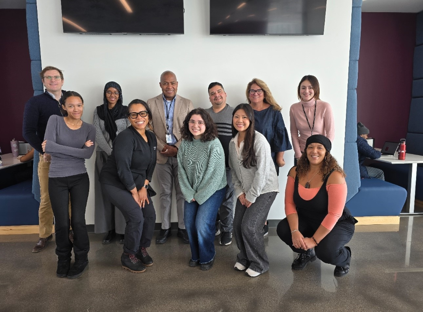 Group of people standing together and smiling