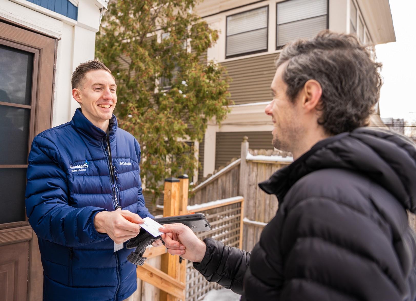 Two people standing together smiling