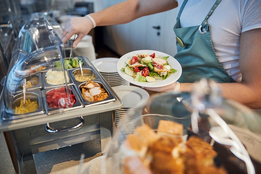 Person serving cafeteria food