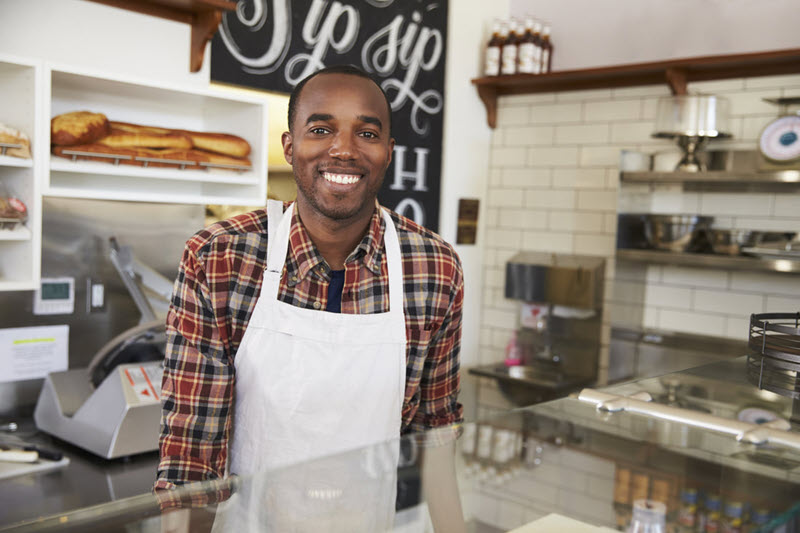 employee smiling in kitchen