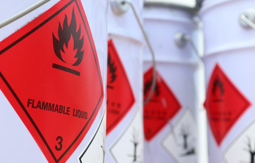 Four white buckets of flammable liquid hazardous materials