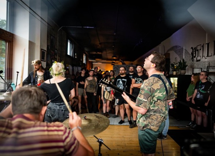 person using disc jockey equipment