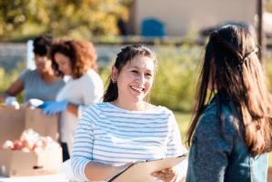 Person with clipboard outside