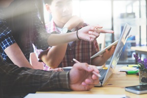 Young people planning together at computer