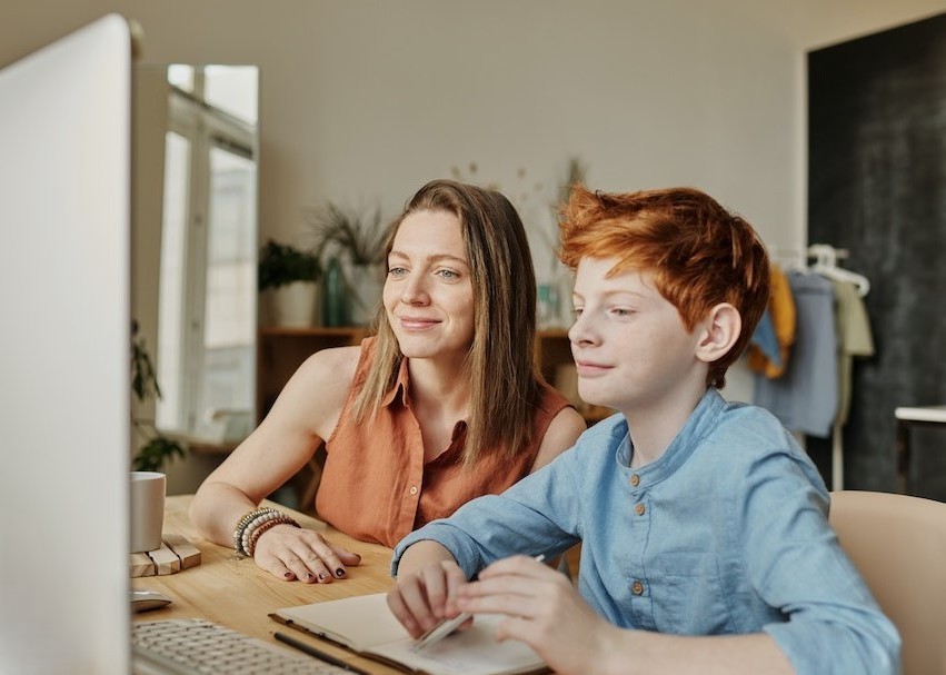 Parent and child using computer