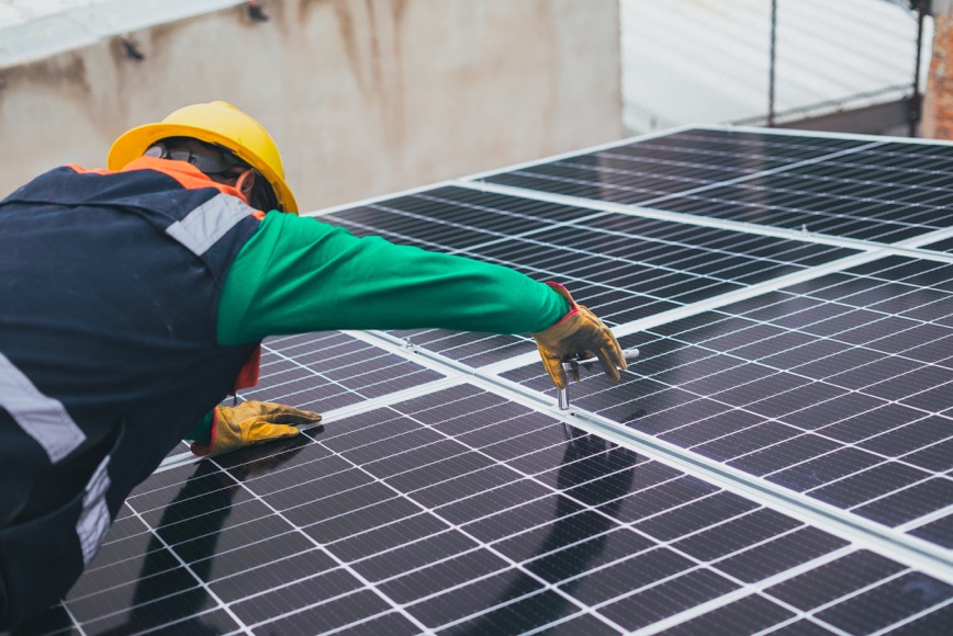 person installing solar panel